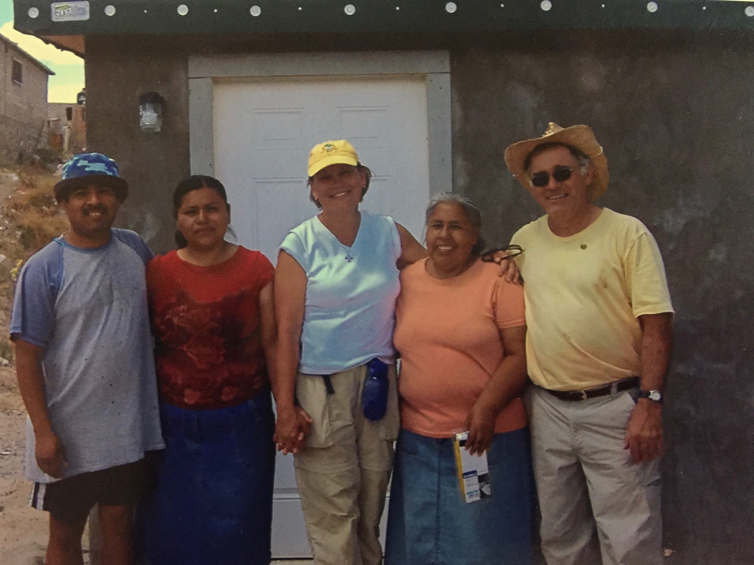 Jane with the family receiving their new home